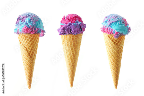 Three cotton candy flavored ice cream cones isolated on a white background. Pink, blue and purple color.