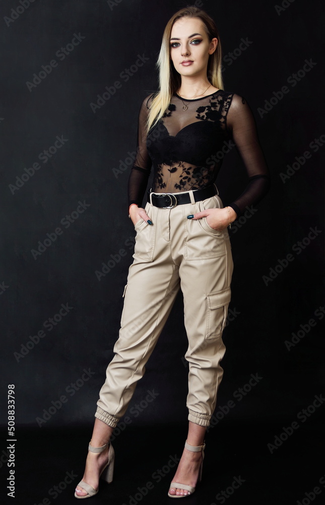 Studio photo session of young Polish model. Beautiful woman with dyed blond hairs and fit body shape. Studio photo session of young Polish model. Beautiful woman with dyed blond hairs and fit body shape.