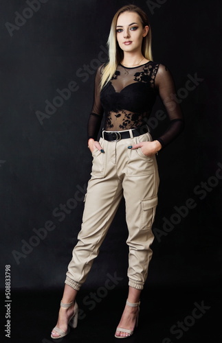 Studio photo session of young Polish model. Beautiful woman with dyed blond hairs and fit body shape.