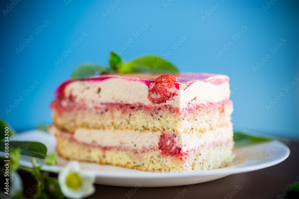 strawberry poppy cake with cream in a plate