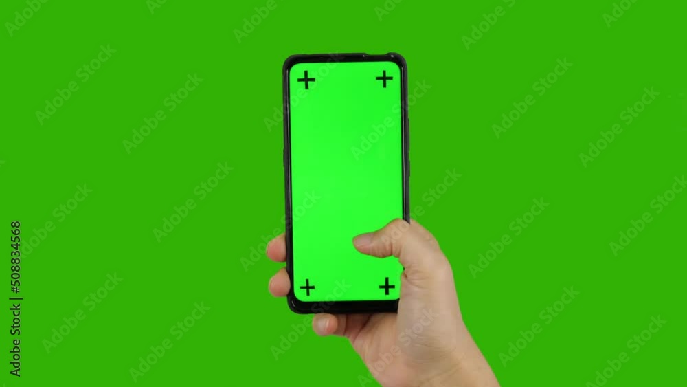 Business man holding a phone with her finger touching the screen, smartphone green screen	