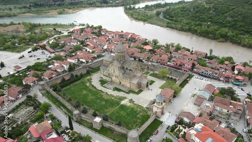 Camera drone flies around the Svetitskhoveli Cathedral in Mtskheta, Georgia photo
