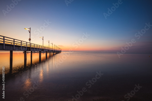 sunrise over the pier in Mechelinki. Baltic Sea 