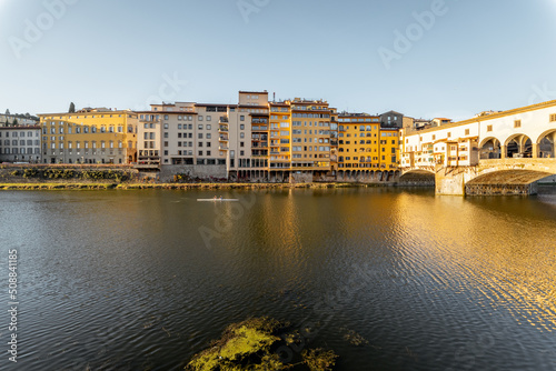 Morning view on famous Old bridge called Ponte Vecchio on Arno river in Florence, Italy. Concept of traveling Italy and visiting italian landmarks