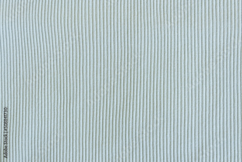 Light green, blue, mint show texture of ribbed cotton fabric wave. Close up. Cotton clothing and textiles. Natural organic fabrics texture light 
