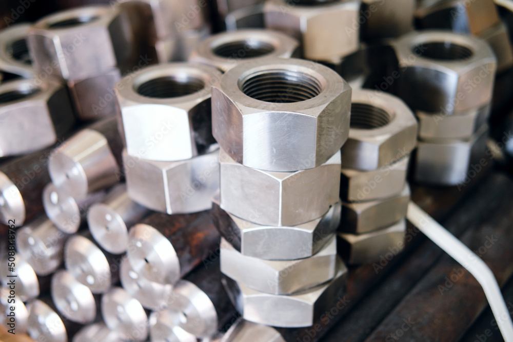 many new nuts of different sizes lie stacked on top of each other