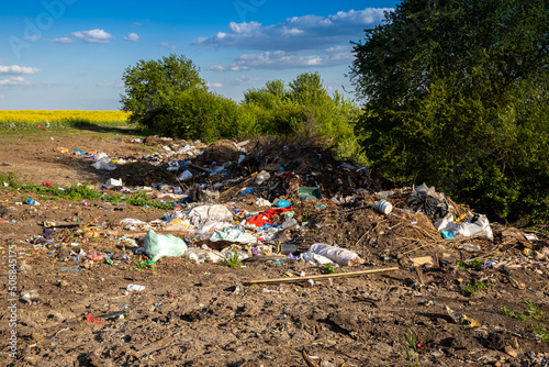 Garbage dump in the open air outside the city.