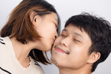 Asian couple happy and fun gesturing cute emoticons on white background.