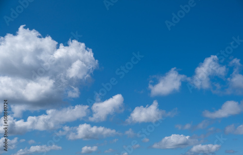 blue sky and white puffy clouds 