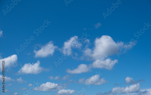 blue sky and white puffy clouds 