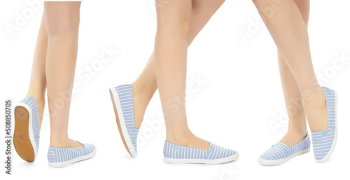 Legs in blue white striped and rhinestone moccasins on a white background. Front side and back view. Shoe example.