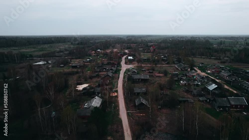 View from the top of the gloomy village settlement and the road with forks. photo