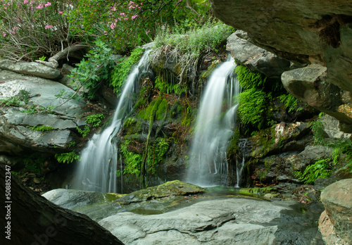 waterfall in the forest of Andros, Cyclades, Greece, with smooth water flow (long exposure) 