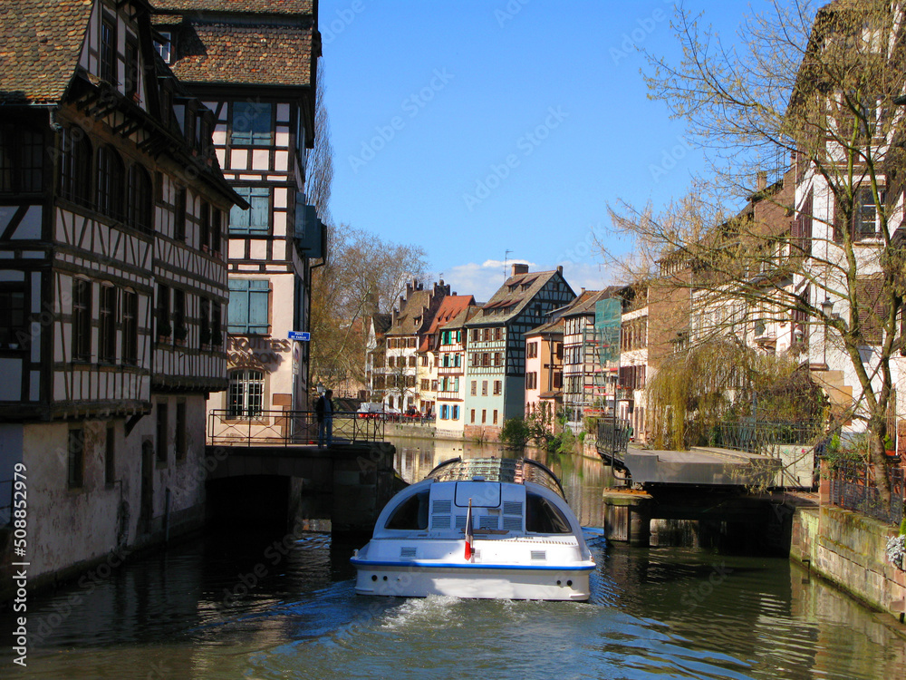 View of the Strasbourg canal, old houses, river tram, spring, April 2009, France