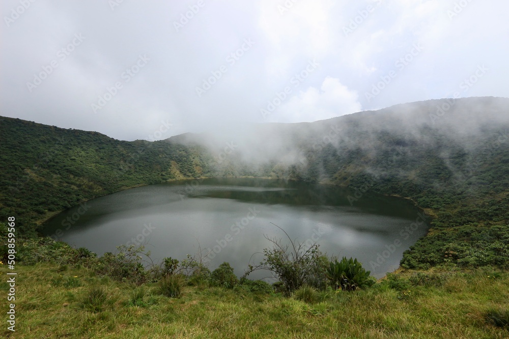rainbow in the fog crater lake bisoke volcano in rwanda 