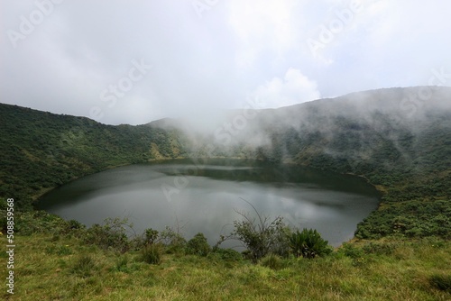 rainbow in the fog crater lake bisoke volcano in rwanda 