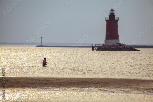 Fishing by Cape Henlopen Lighthouse photo