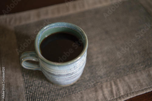 ceramic pottery mug with black coffee