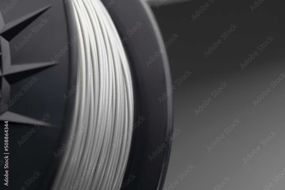 Filament for 3D printer. Filament for printing plastic parts on a 3D printer. Close-up - obrazy, fototapety, plakaty 