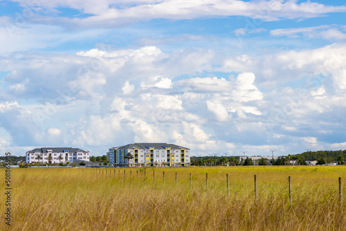 Εκτύπωση καμβά Apartment building construction next to rural field