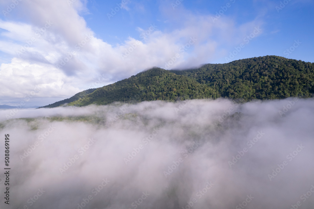 Amazing Landscape light nature scenery view, Beautiful light sunrise or sunset over Tropical sea and foggy mist on mountains peak in thailand Aerial view Drone camera shot High angle view