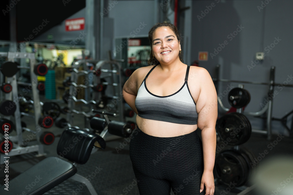 Happy overweight woman losing weight with exercise Happy overweight woman losing weight with exercise