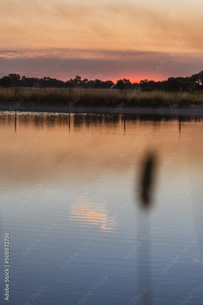 Naklejka premium sunset over lake