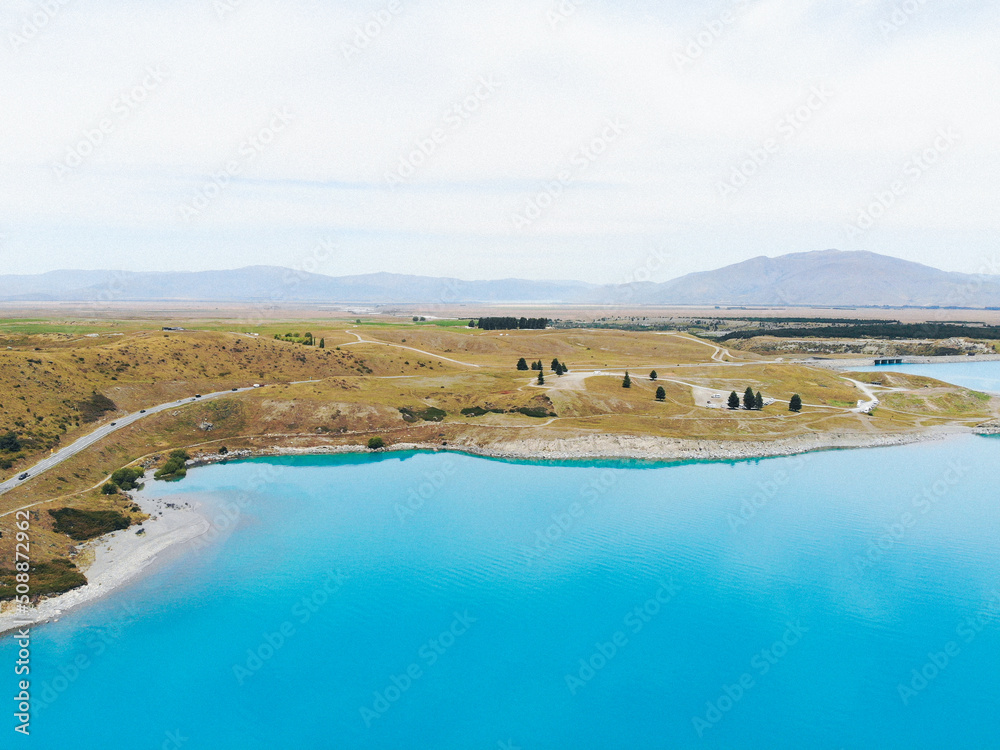 Aerial photography of Blue Lake Pukaki. Beautiful New Zealand landscape background. Road. Nature. Silence