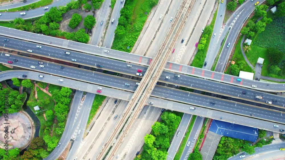 Stunning Aerial view drone shot above freeway traffic. 4K drone. traffic in Nonthaburi thailand
Stunning Aerial view drone shot above freeway traffic. 4K drone. traffic in Nonthaburi thailand