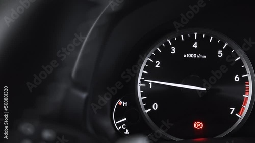 Turning on the ignition on the dashboard of the car