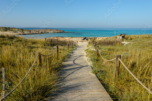  Es Trucadors  beach on the island of Formentera. Located northeast of the island. With access through a wooden walkway to a quiet area of sand and crystal clear waters.