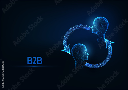 Futuristic business to business B2B concept with glowing low polygonal two human heads and arrows 