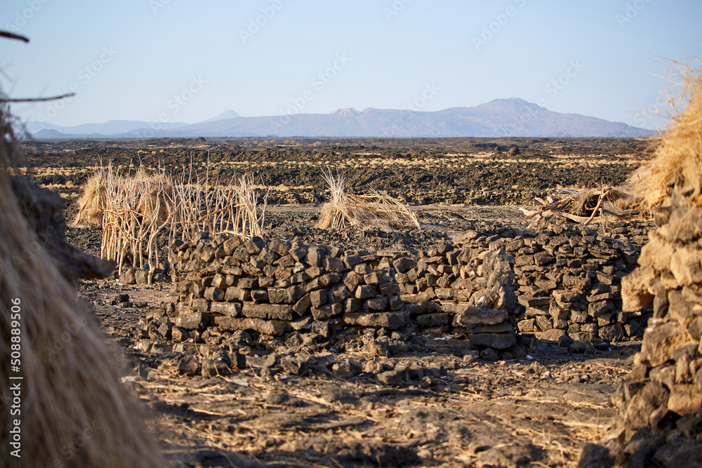 12. The shelters at Erta Ale volcano, built by stacking purple-red rocks like red bricks, Danakil, Ethiopia