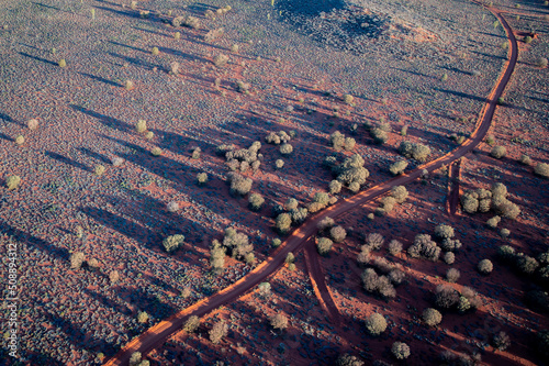 Ariel Landscape view of dirt road in aboriginal country, Northern Territory Australia, creating natural artwork. © MK3 Design