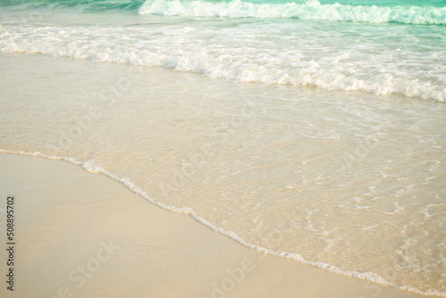 Soft wave on sand beach at coast with blue sea ocean tropical nature. tourism vacation travel summer in holidays. white texture wallpaper island flat lay.
