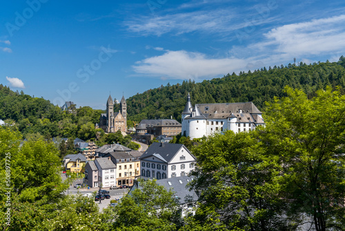 view of the picturesque and historic city center of Clervaux with castle and church in northern Luxembourg