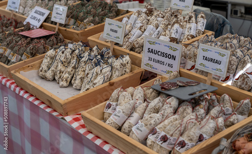 close-up view of traditional sausage and salami at a market stand in the hsitoric city center of Clervaux photo