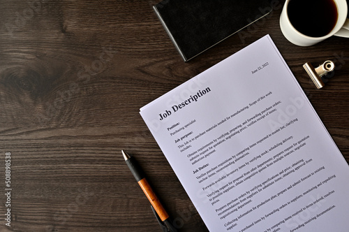Εκτύπωση καμβά There is dummy documents on the desk about Job Description.