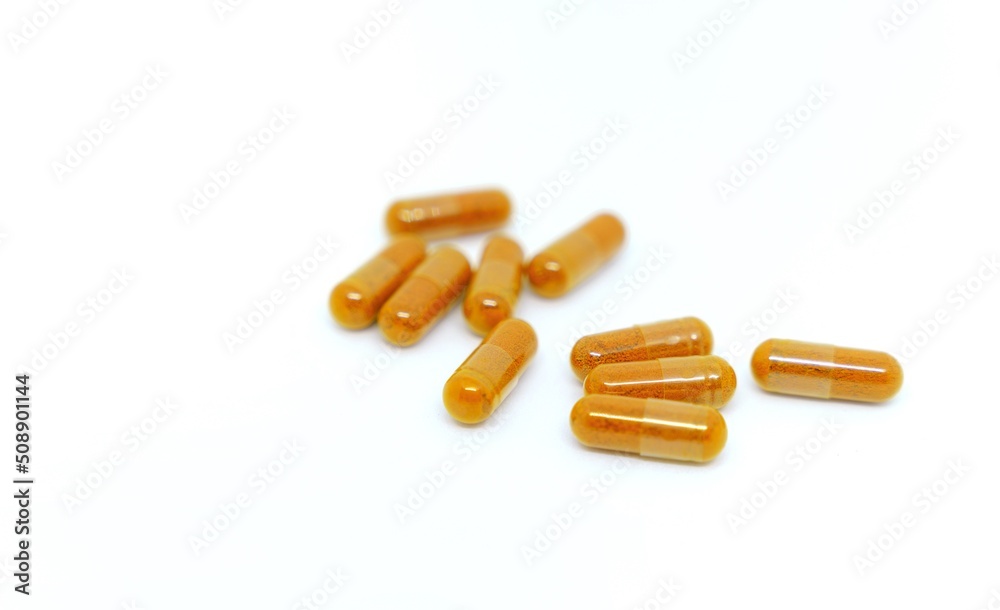 Several pills laid out on a white background. Several pills laid out on a white background.