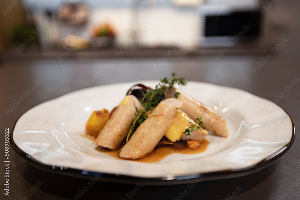 Appetizing vegetable stew with pasta on a plate in the kitchen Appetizing vegetable stew with pasta on a plate in the kitchen