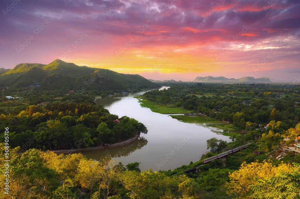 The beautiful landscape in the morning of the Kwai Noi River curve and the mountains at the Golden Chedi Viewpoint Wat Tham Khao Pun, Kanchanaburi.
