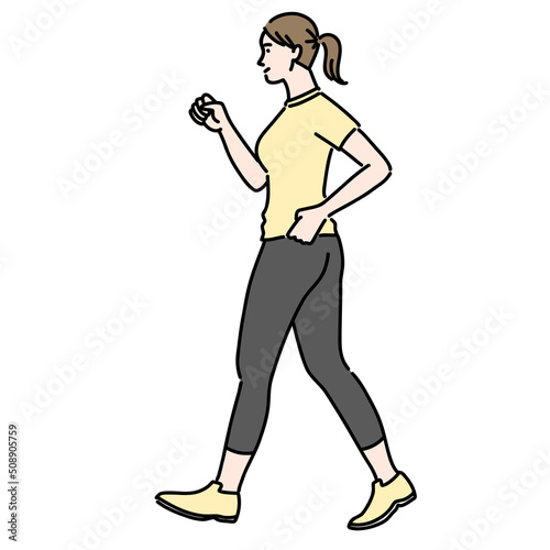 スポーツウェアを着てウォーキングしている若い女性