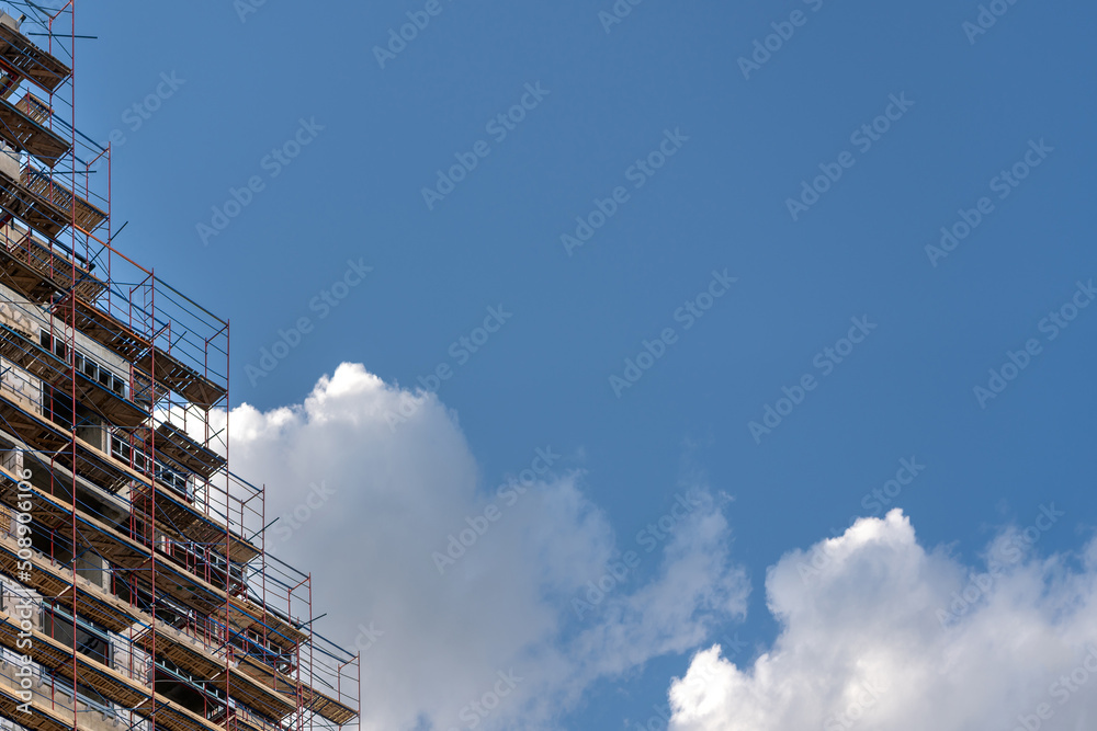 Facade of a house under construction. Мodern building industry. Sale and rental of real estate. Facade of a house under construction. Мodern building industry. Sale and rental of real estate.