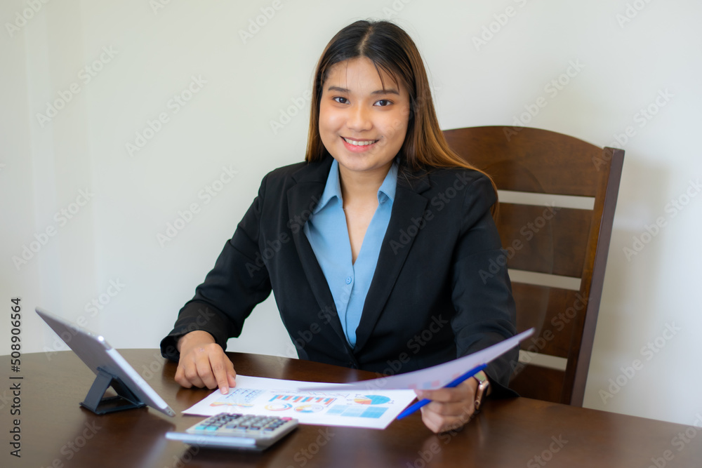 Finance business people or accountants, Taxes and audit concept, accountant woman checking paperwork from the accounting department to analyze number on document information comparing
