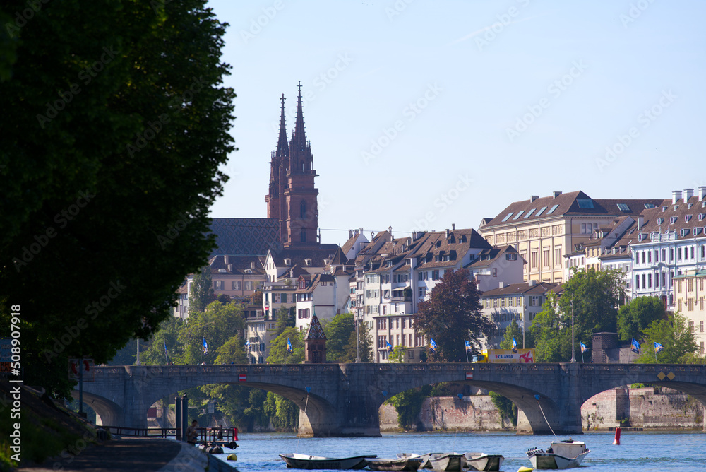 Skyline of the old town of Basel with famous Basler Münster (Basler Minster) and Middle Rhine Bridge on a sunny spring day. Photo taken May 11th, 2022, Basel, Switzerland.