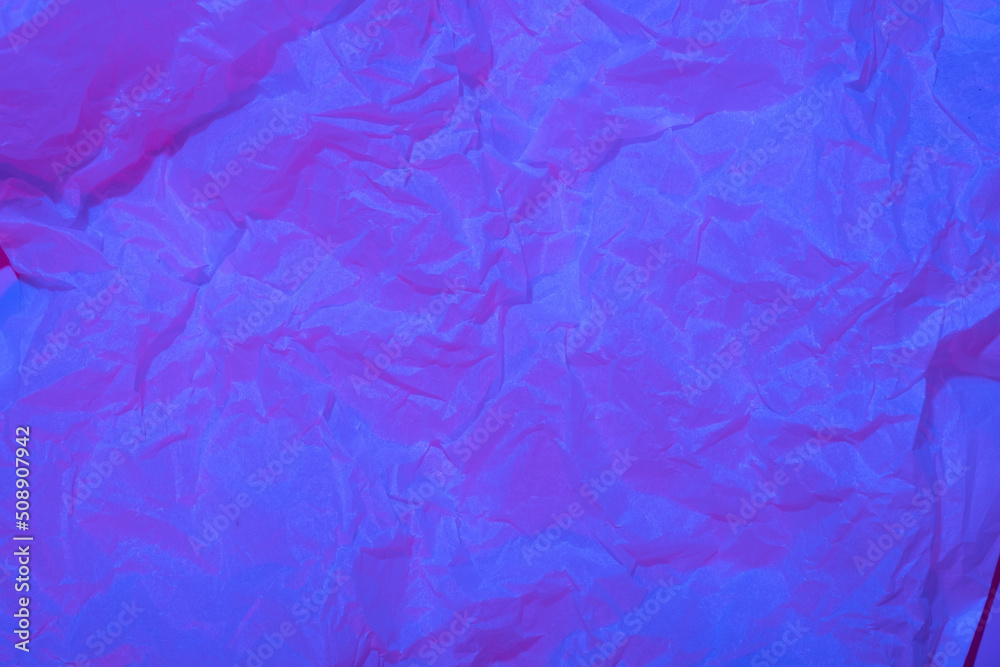 Abstract crumpled paper background in neon light Abstract crumpled paper background in neon light