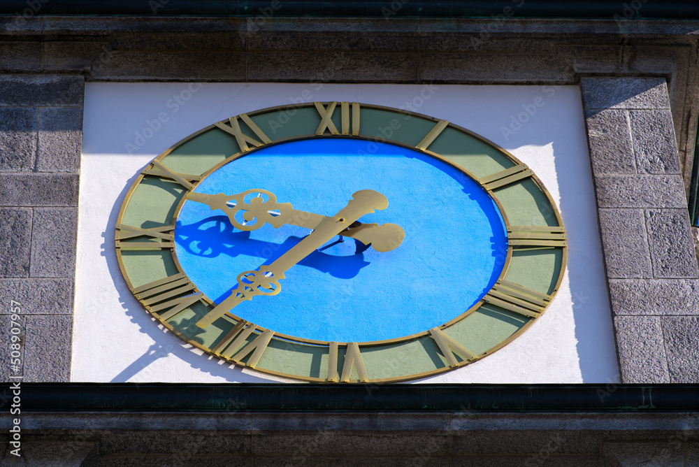 Fototapeta premium Close-up of clock at white apostolic church at the old town of Basel on a sunny spring day. Photo taken May 11th, 2022, Basel, Switzerland.