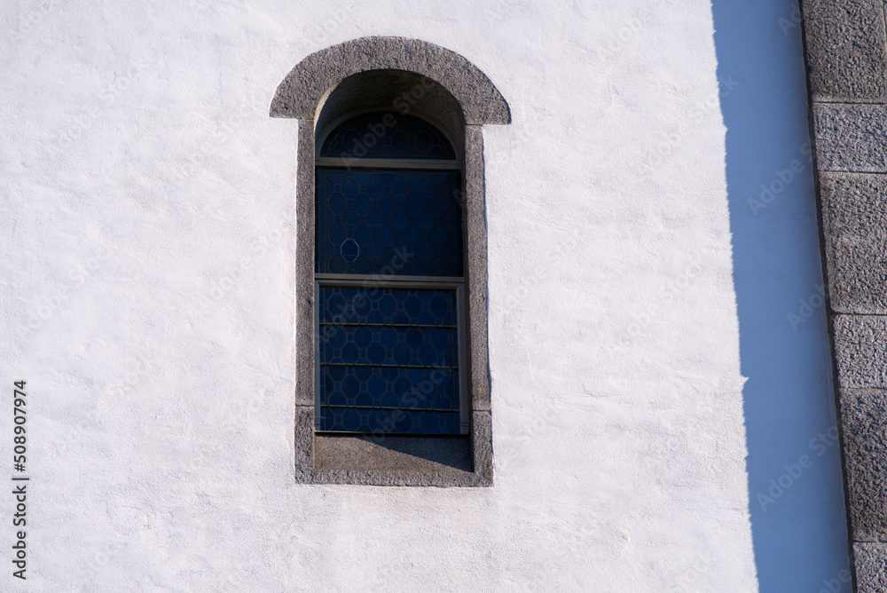 Close-up of window of white apostolic church at the old town of Basel on a sunny spring day. Photo taken May 11th, 2022, Basel, Switzerland. Close-up of window of white apostolic church at the old town of Basel on a sunny spring day. Photo taken May 11th, 2022, Basel, Switzerland.