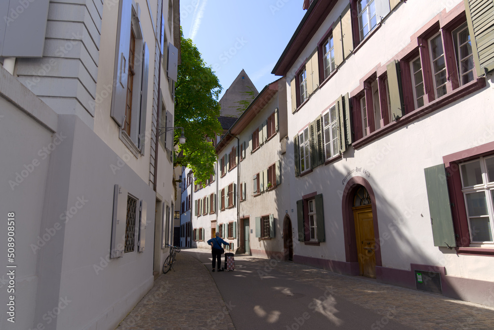 Alley with historic medieval houses at the old town of Basel on a sunny spring day. Photo taken May 11th, 2022, Basel, Switzerland.