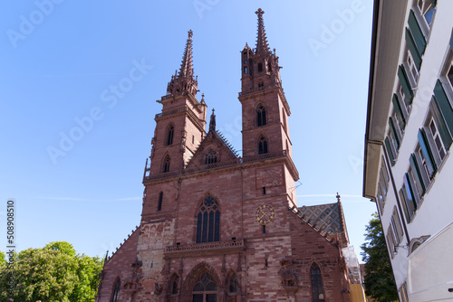 Medieval church named Basler Minster at the old town of Basel on a sunny spring day. Photo taken May 11th, 2022, Basel, Switzerland.